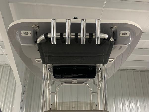 Slide: The Image of 2024 Key West 244 Center Console boat with T-top and rod holders. - 17
