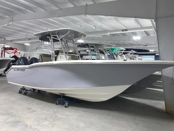 Slide: The Image of 2024 Key West 244 Center Console boat in showroom. - 2