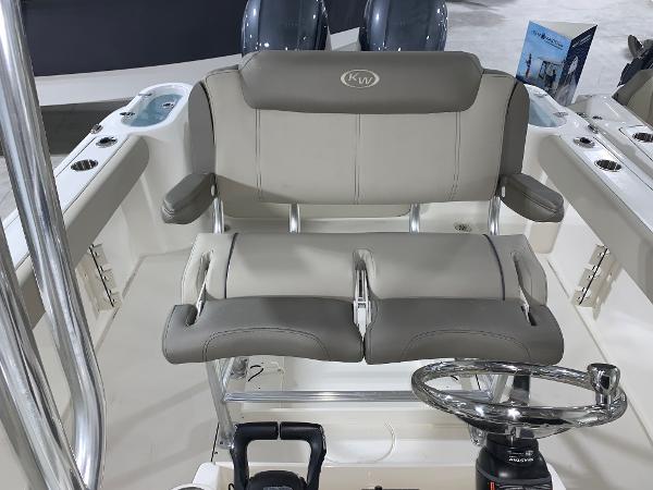 Slide: The Image of 2024 Key West 244 Center Console boat interior with dual seating and steering wheel. - 9