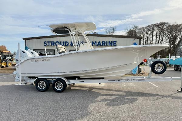 The Image of 2025 Key West 244 Center Console boat on trailer at Stroud Marine dealership. - 1