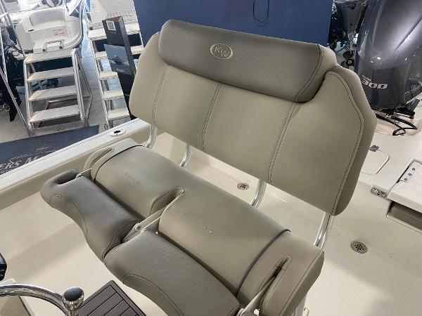 Slide: The Image of 2024 Key West 250 Bay Reef boat with cushioned seating. - 12