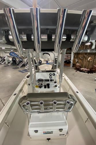 Slide: The Image of 2024 Key West 250 Bay Reef center console boat interior with rod holders. - 16