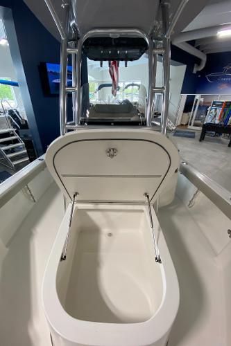 Slide: The Image of 2024 Key West 250 Bay Reef boat interior with open storage compartment. - 22