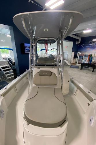 Slide: The Image of 2024 Key West 250 Bay Reef boat interior with T-top and seating. - 23