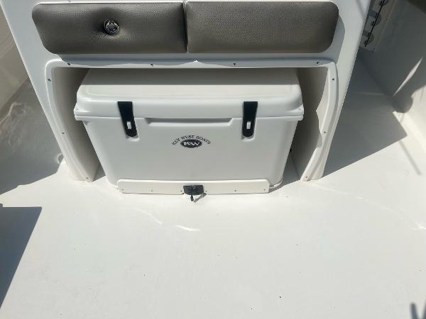 Slide: The Image of 2023 Key West 263 FS boat with built-in cooler storage. - 10