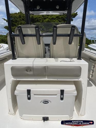 Slide: The Image of 2023 Key West 263 FS boat interior with cooler and seating. - 11
