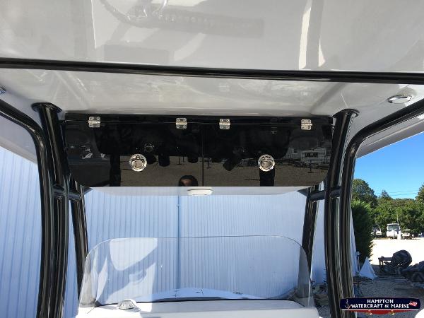 Slide: The Image of 2023 Key West 263 FS boat console with T-top and storage compartments. - 15