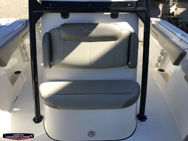 Slide: The Image of 2023 Key West 263 FS boat seating area with cushioned backrest and seat. - 19