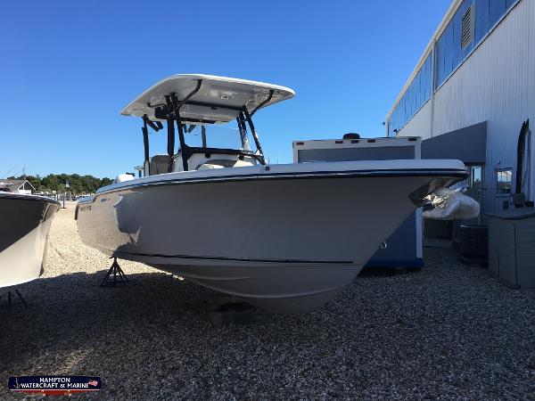 Slide: The Image of 2023 Key West 263 FS boat displayed outdoors at a marina. - 3