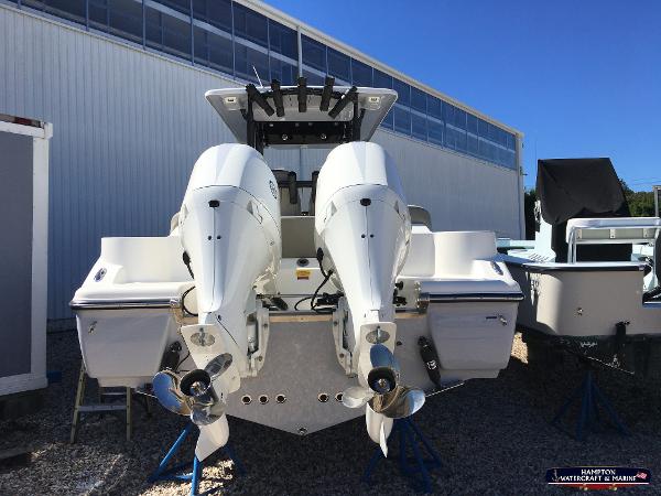 Slide: The Image of 2023 Key West 263 FS boat with twin outboard engines, rear view. - 6