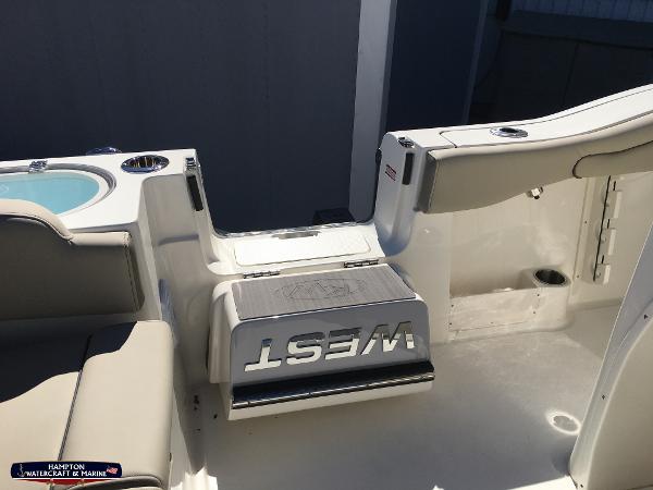 Slide: The Image of 2023 Key West 263 FS boat interior with seating and storage compartments. - 9