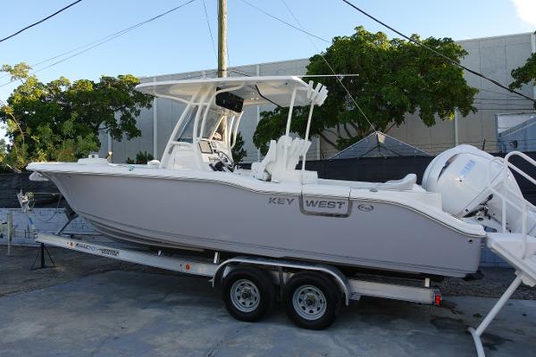 Slide: The Image of 2024 Key West 263 FS boat on a trailer, side view. - 1