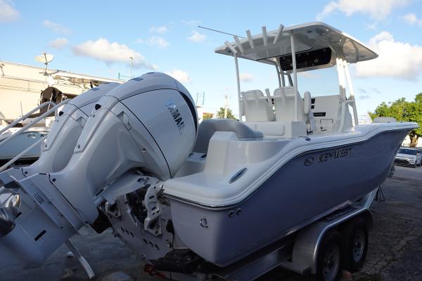 Slide: The Image of 2024 Key West 263 FS boat with Yamaha engine on trailer. - 10