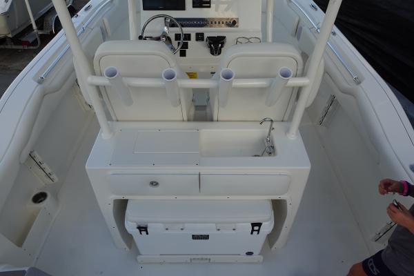 Slide: The Image of 2024 Key West 263 FS boat interior with helm, seating, and storage. - 11