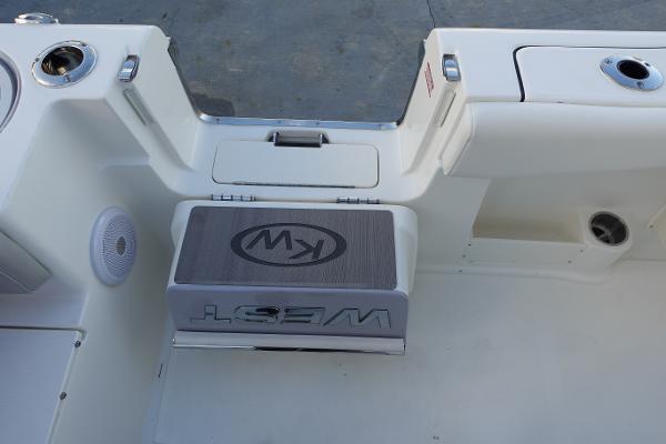 Slide: The Image of 2024 Key West 263 FS boat interior with seating and storage compartments. - 14