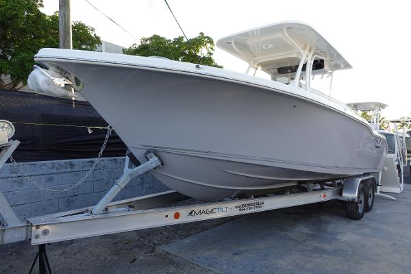 Slide: The Image of 2024 Key West 263 FS boat on a trailer, side view. - 2