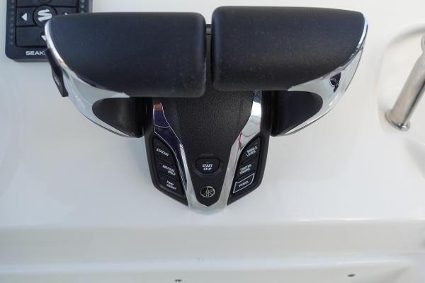Slide: The Image of Throttle controls of a 2024 Key West 263 FS boat. - 21