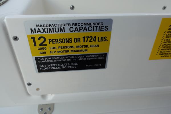 Slide: The Image of 2024 Key West 263 FS boat capacity label: 12 persons or 1724 lbs, 600 HP motor max. - 22