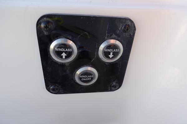 Slide: The Image of 2024 Key West 263 FS windlass control panel with up, down, and on/off buttons. - 29