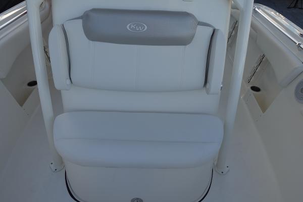 Slide: The Image of 2024 Key West 263 FS boat seating area with cushioned backrest and armrests. - 31