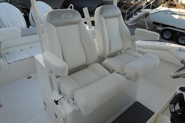 Slide: The Image of 2024 Key West 263 FS boat with dual white captain's chairs. - 36