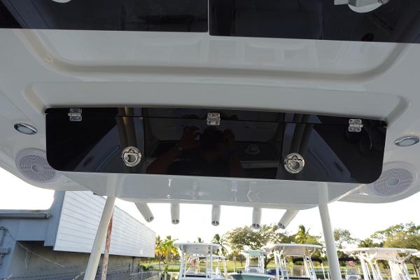 Slide: The Image of 2024 Key West 263 FS boat console with storage compartments and speakers. - 38