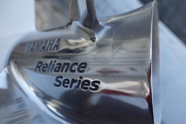 Slide: The Image of Close-up of Yamaha Reliance Series propeller on 2024 Key West 263 FS boat. - 8
