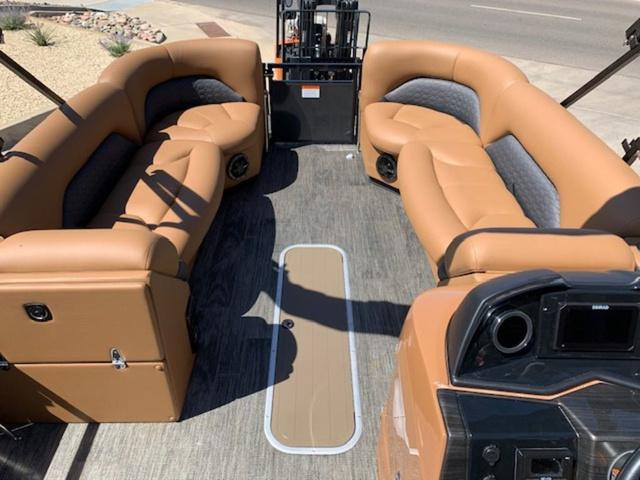 Slide: The Image of 2024 Landau Atlantis 250 Swingback Rear Lounge Tri-Log interior with tan seating. - 10