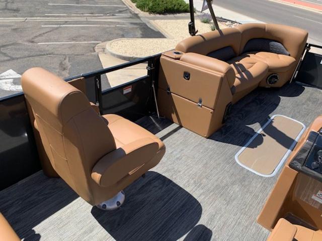 Slide: The Image of 2024 Landau Atlantis 250 Swingback Rear Lounge Tri-Log interior with tan leather seating. - 14
