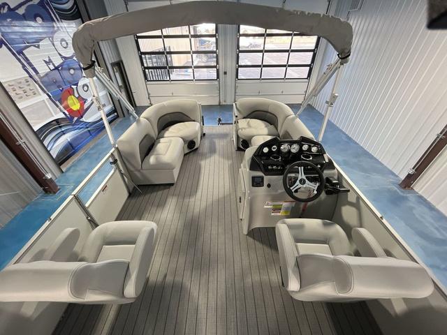 Slide: The Image of 2024 Landau Island Breeze 212 Sport Rear Lounge Tri-Log pontoon boat interior with plush seating. - 10