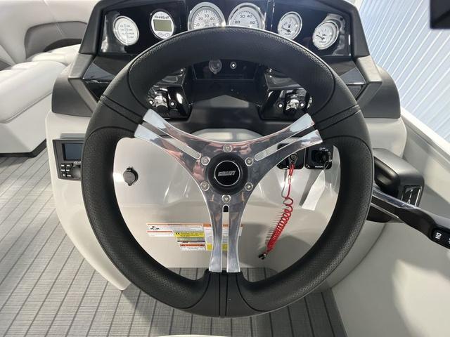 Slide: The Image of 2024 Landau Island Breeze 212 Sport Rear Lounge Tri-Log steering wheel and dashboard. - 14