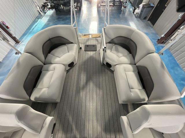 Slide: The Image of 2024 Landau Island Breeze 212 Sport Rear Lounge Tri-Log interior with spacious seating. - 18