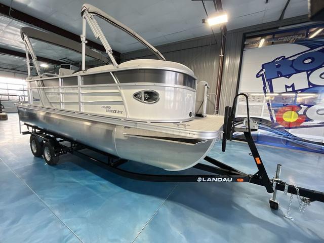 Slide: The Image of 2024 Landau Island Breeze 212 Sport Rear Lounge Tri-Log pontoon boat on trailer. - 7