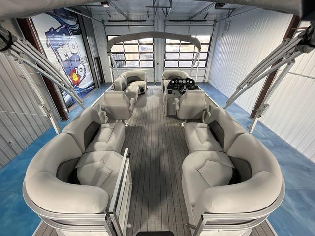 Slide: The Image of 2024 Landau Island Breeze 212 Sport Rear Lounge Tri-Log interior, spacious seating, modern design. - 9