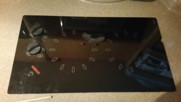 Slide: The Image of Black glass cooktop with two knobs on a 2003 Larson 330 Cabrio boat. - 19