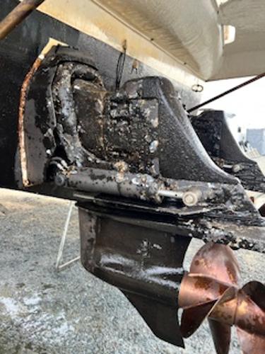 Slide: The Image of Close-up of a 2003 Larson 330 CABRIO boat's propeller and stern drive. - 22
