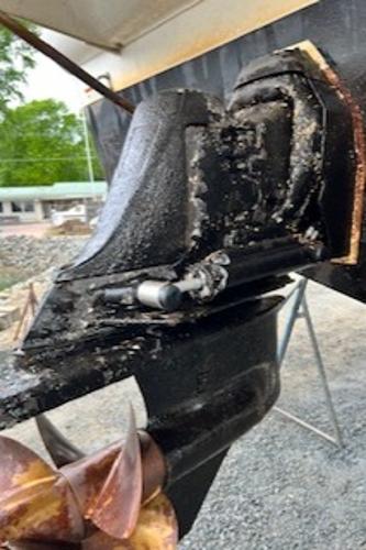 Slide: The Image of Close-up of a 2003 Larson 330 CABRIO boat's propeller and stern drive. - 29