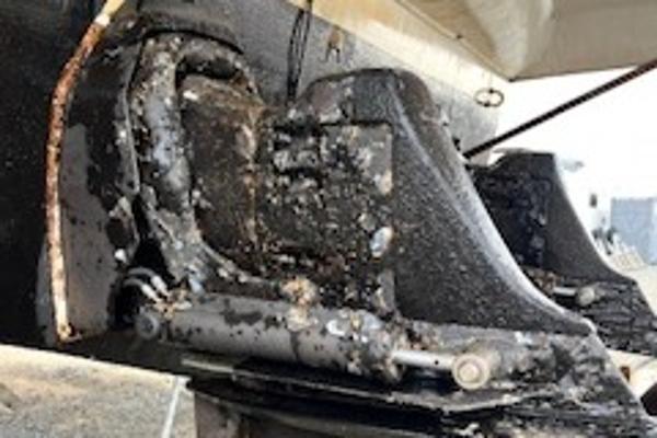 Slide: The Image of Close-up of a 2003 Larson 330 CABRIO boat's corroded engine component. - 30