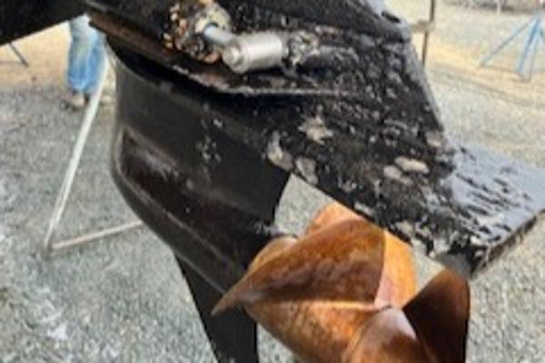 Slide: The Image of Close-up of a 2003 Larson 330 CABRIO boat propeller with visible wear and corrosion. - 32