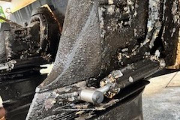 Slide: The Image of Close-up of a 2003 Larson 330 CABRIO boat engine with visible wear and corrosion. - 33