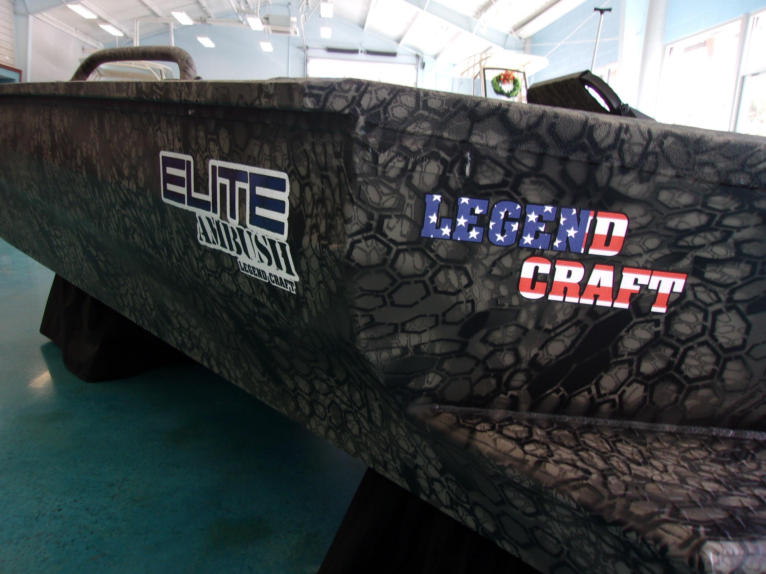 Slide: The Image of 2023 Legendcraft Boats Ambush Elite 1656, camo design, indoor display. - 12