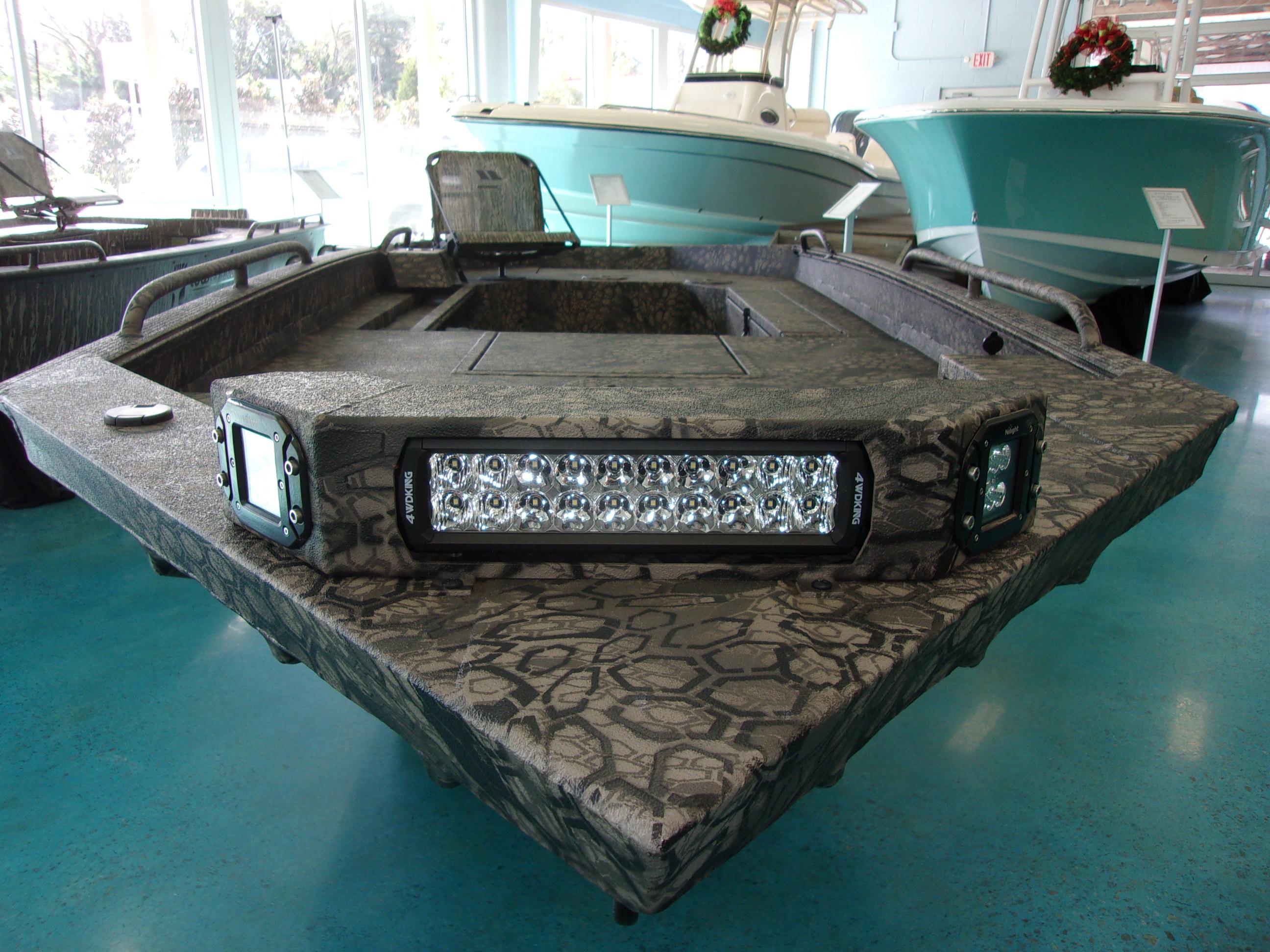Slide: The Image of 2023 Legendcraft Boats Ambush Elite 1656 in showroom, front view with LED lights. - 2