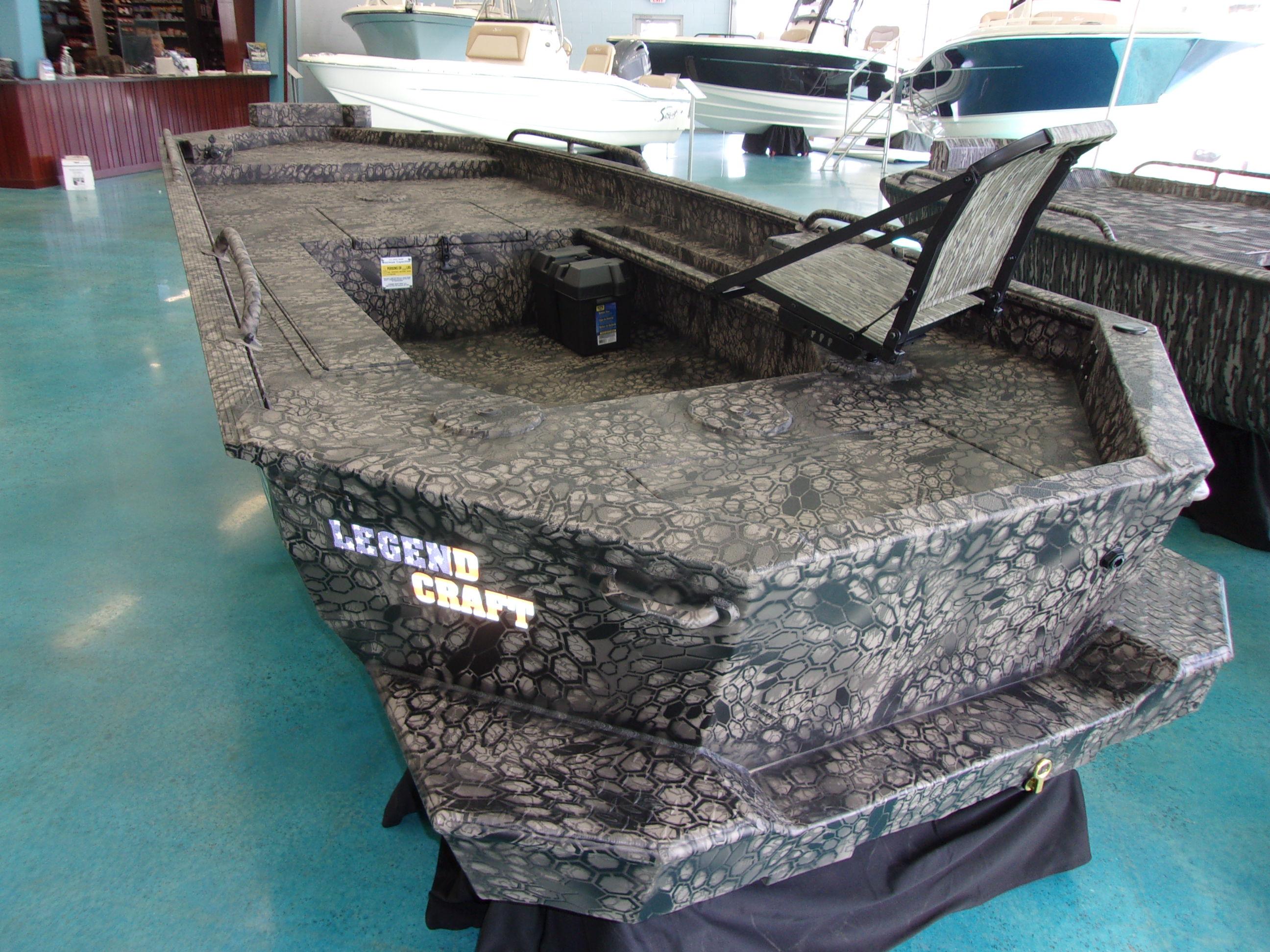 Slide: The Image of 2023 Legendcraft Boats Ambush Elite 1656 in showroom, camo pattern, side view. - 3