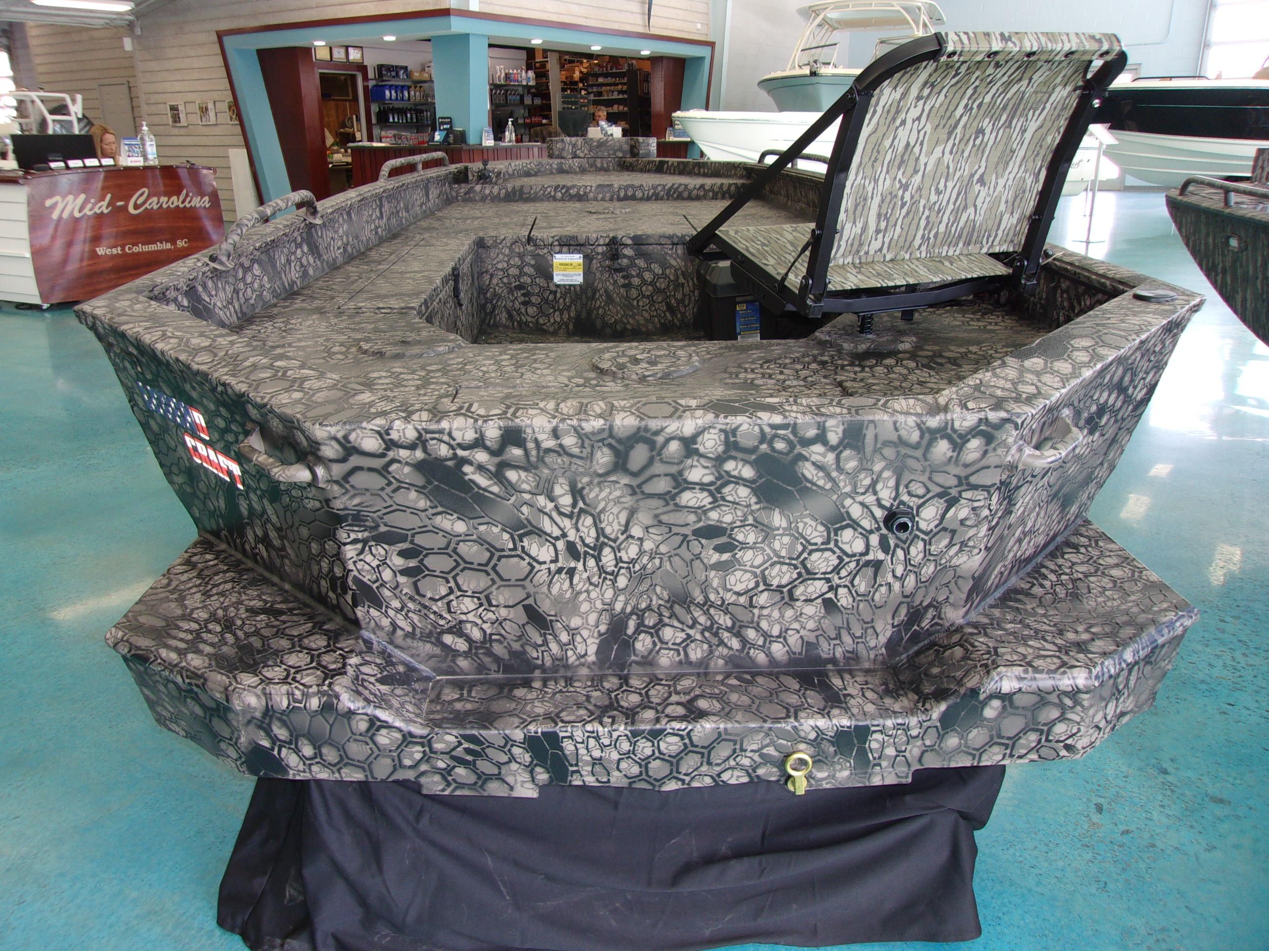 Slide: The Image of 2023 Legendcraft Boats Ambush Elite 1656 in showroom, camo pattern, West Columbia, SC. - 7