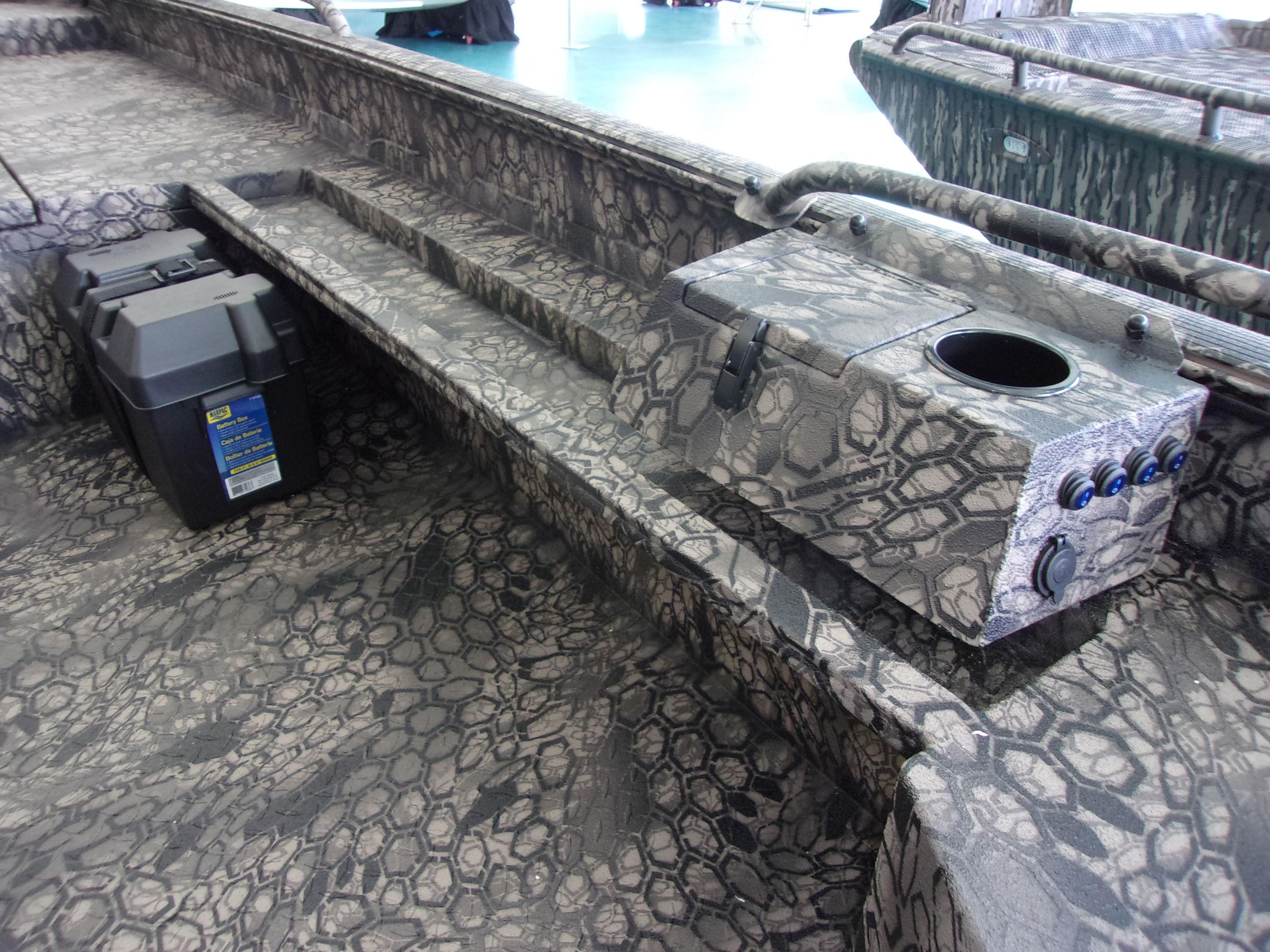 Slide: The Image of 2023 Legendcraft Boats Ambush Elite 1656 interior with camo pattern and control panel. - 8