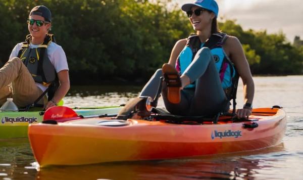 Slide: The Image of Two people kayaking on Liquidlogic Manta Ray Propel 12 kayaks, enjoying a sunny day on the water. - 0
