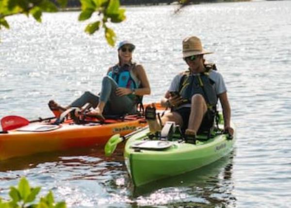 Slide: The Image of Two people kayaking on Liquidlogic Manta Ray Propel 12 kayaks, 2023 model. - 7