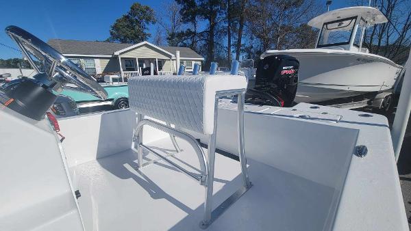 Slide: The Image of 2024 Lookout Skiff Bay 19 boat interior with steering wheel and seating. - 11