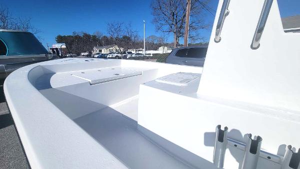 Slide: The Image of 2024 Lookout Skiff Bay 19 boat deck in a parking lot. - 13