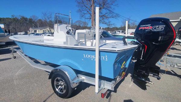 Slide: The Image of 2024 Lookout Skiff Bay 19 boat on trailer with Mercury Pro XS outboard motor. - 4